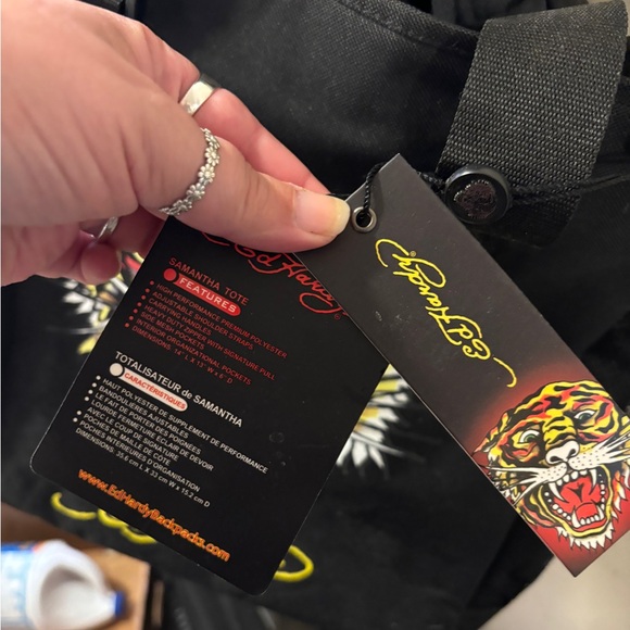 An Ed Hardy messenger bag. - Picture 3 of 6